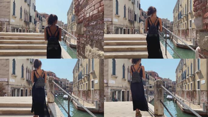 美丽的女孩在意大利威尼斯漫步。