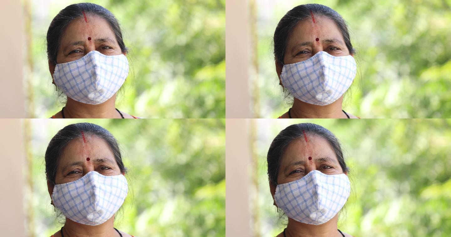 一位年长的女士戴着口罩以防病毒