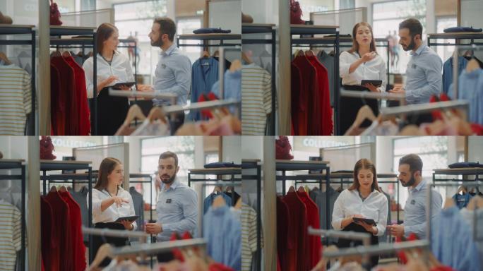 女商人使用平板电脑与视觉营销专家交谈