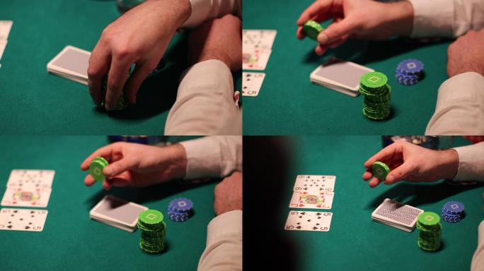 在扑克游戏中，自信的男人手里拿着扑克筹码