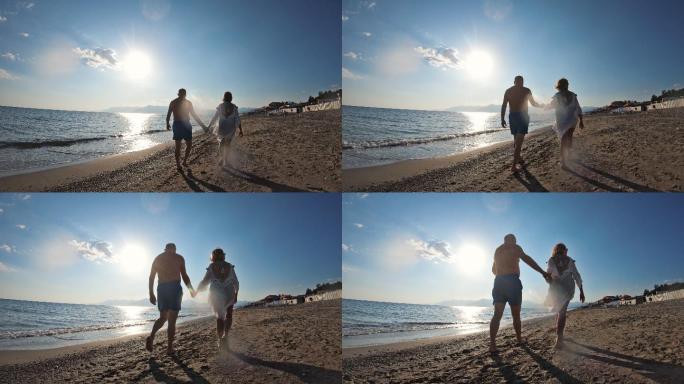 恋爱中的夫妇在海滩上散步