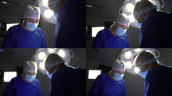在手术室进行手术的外科医生团队