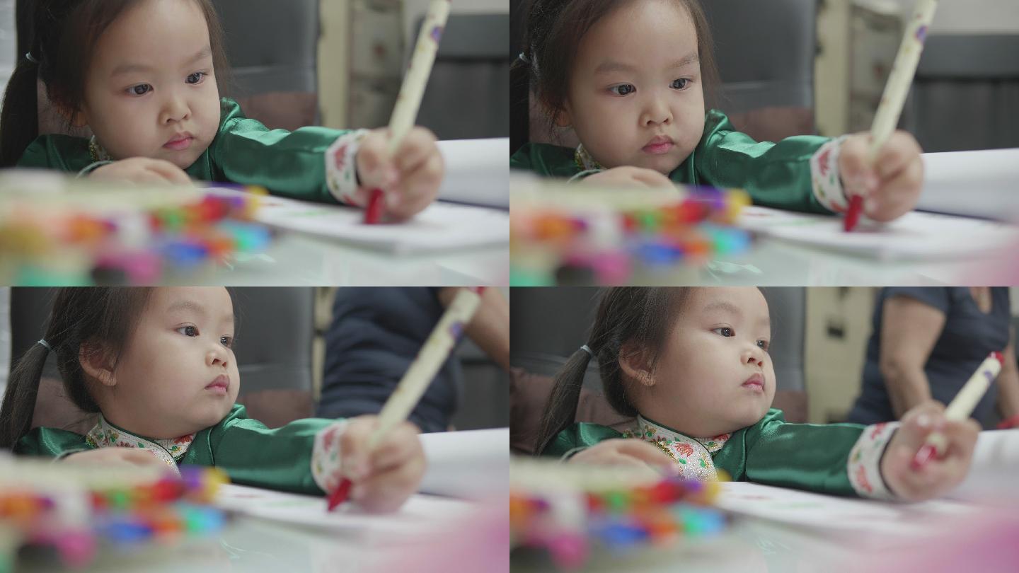 女孩正在用彩色铅笔画画