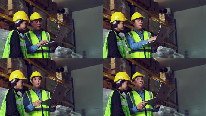两名仓库工人正在检查笔记本电脑上的信息。