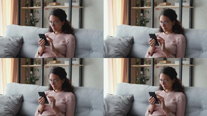 年轻女性使用智能手机浏览社交媒体