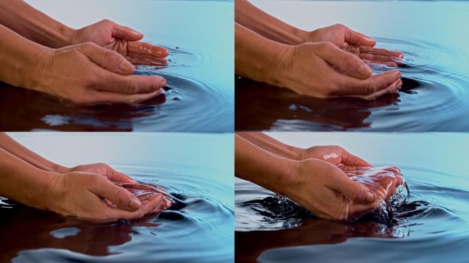 女性用杯状双手舀水