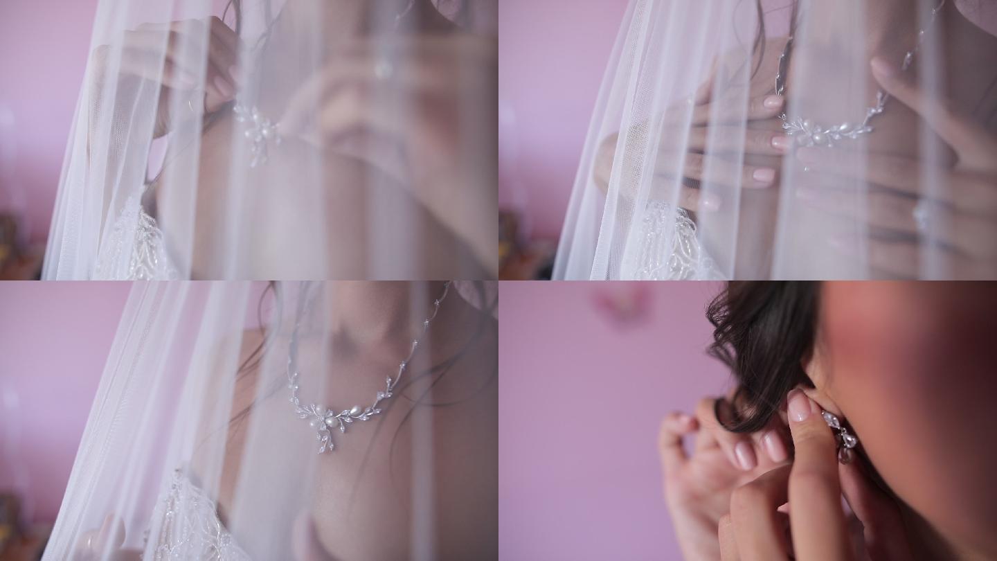 年轻的新娘戴上她的珠宝
