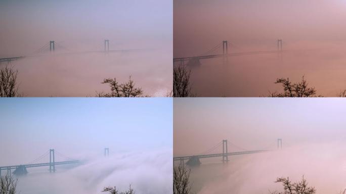 夕阳下的大连跨海大桥平流雾