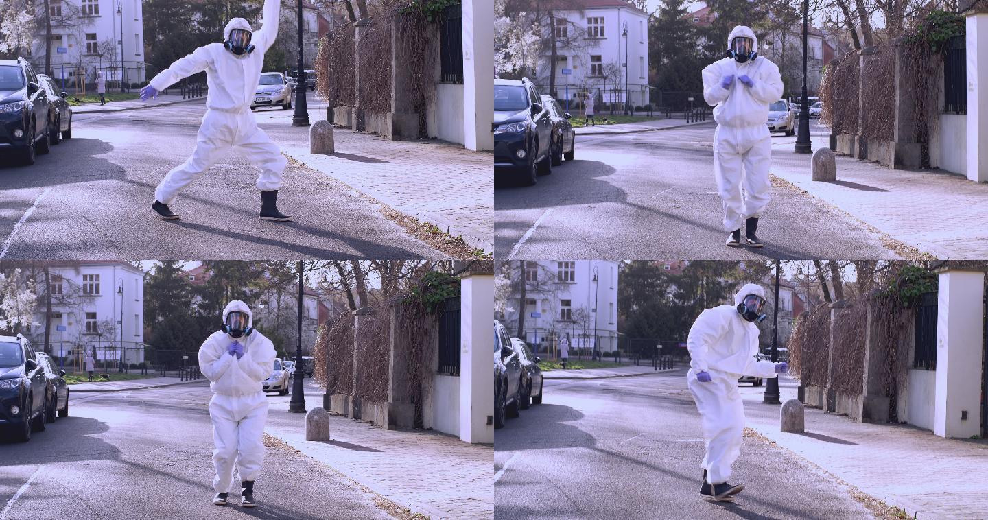 穿着防护服的医生在城市的街道上跳舞。