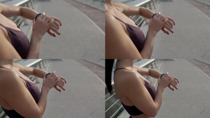 调动手表的女人晨跑运动健康生活公园锻炼