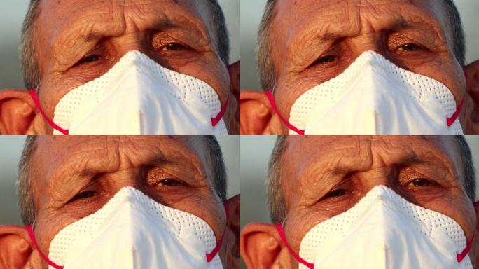 老人戴着口罩，以防感染病毒