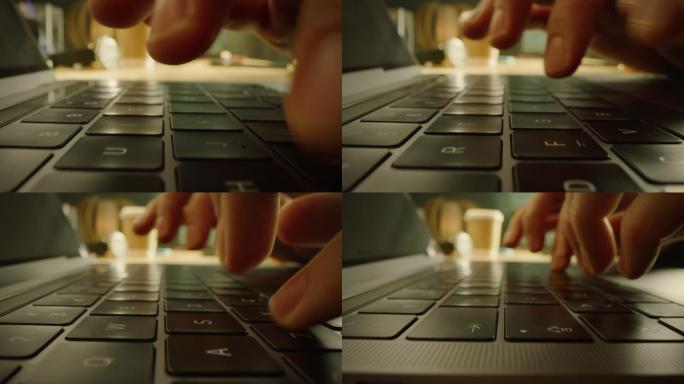 特写镜头：在电脑键盘上打字的人