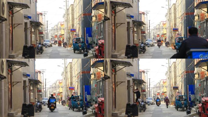 北京城市村里人文生活街道行人骑车经过