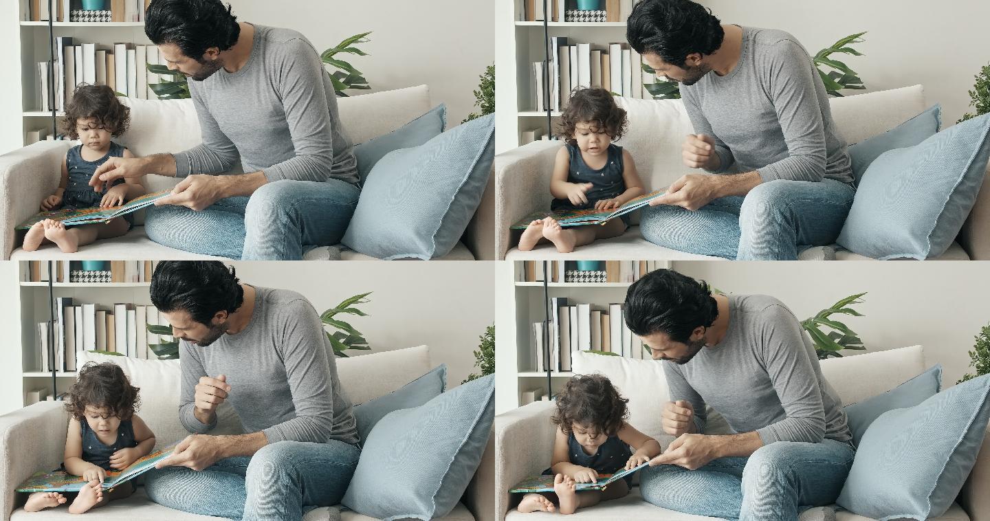 父亲在家教小男孩看画本