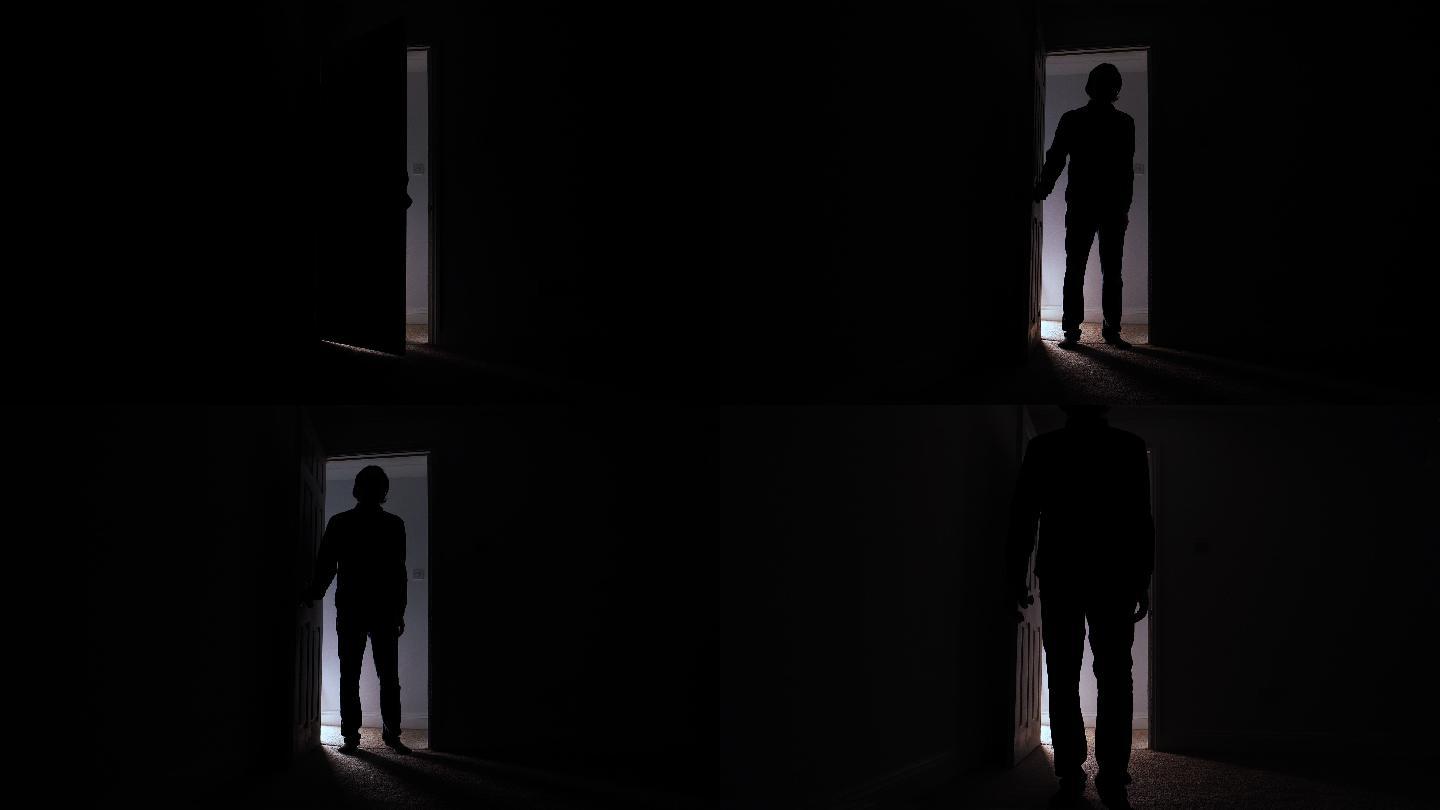 男人打开门，走进黑暗的房间