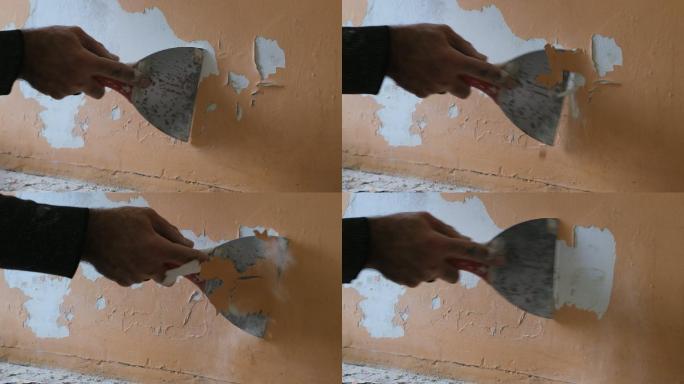 在旧墙上剥掉油漆慢动作