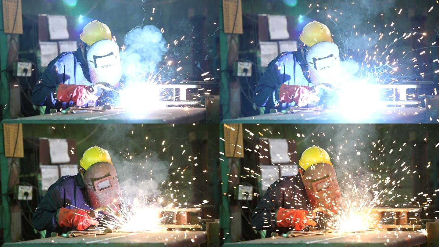 工业工人在工厂焊接金属零件