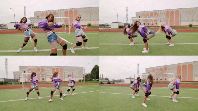 一群年轻女性在体育场户外跳嘻哈舞蹈。