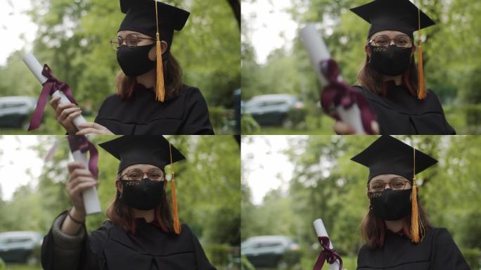 毕业的少女戴口罩学士服学位服
