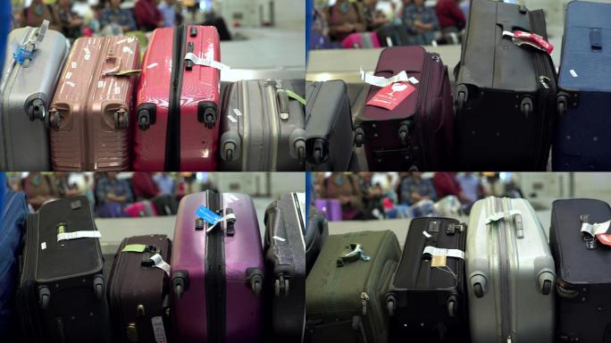 各种颜色的旅行袋或旅客被运送到传送带上。