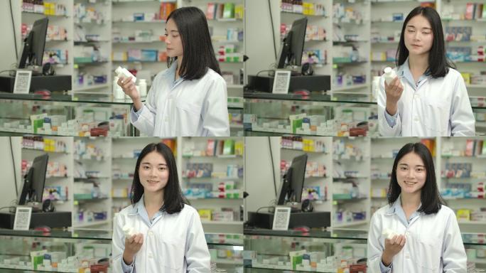 一位年轻的药剂师在药店看着摄像机微笑