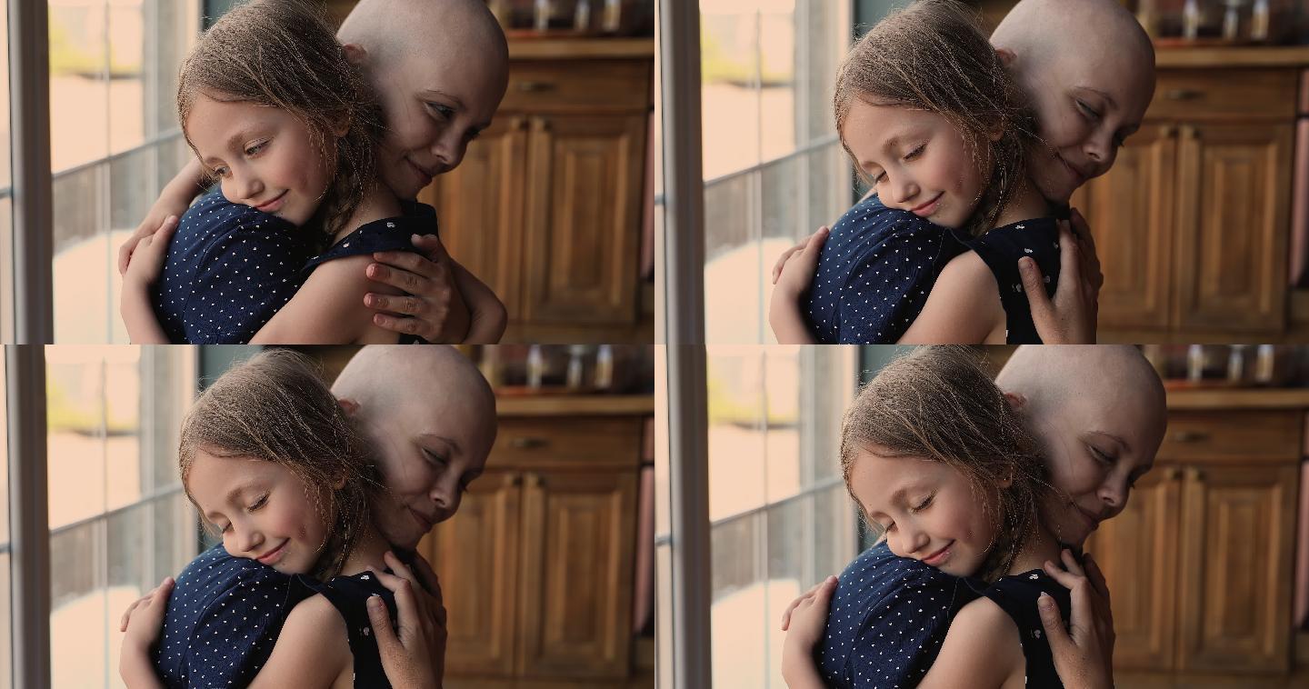 小女孩和患癌症的母亲拥抱