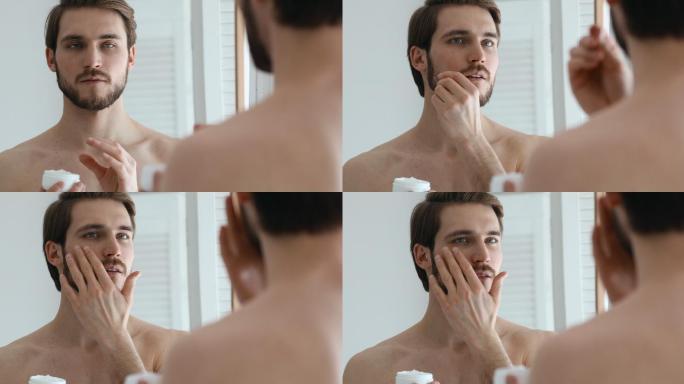 男人涂抹保湿面膜。