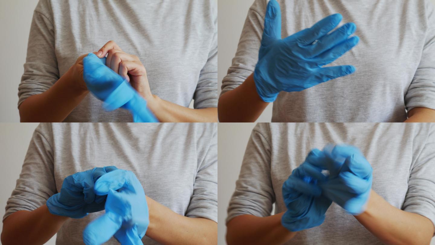 女性的手戴上蓝色的橡胶手套