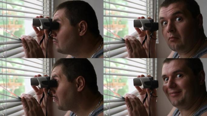 男人用双筒望远镜观察