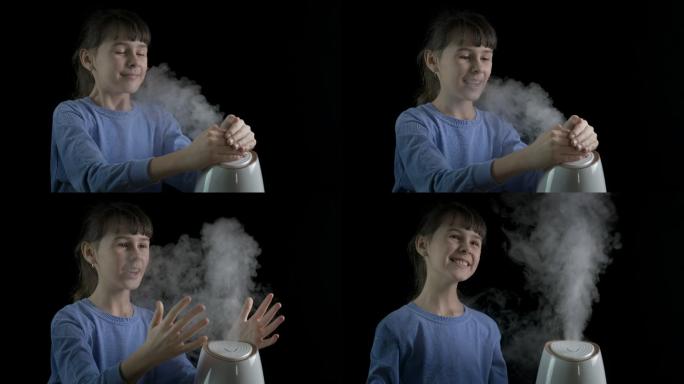 一个快乐的小女孩用加湿器