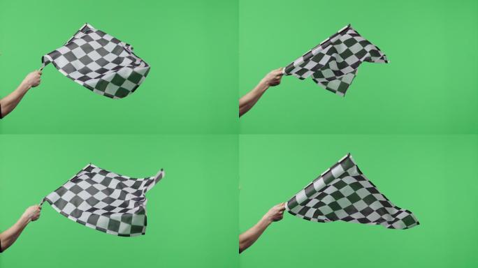 在绿色屏幕背景下，手持并缓慢挥舞方格旗。