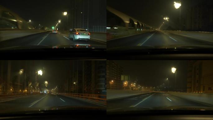 夜晚城市开车行驶在夜深人静空荡荡的高架桥