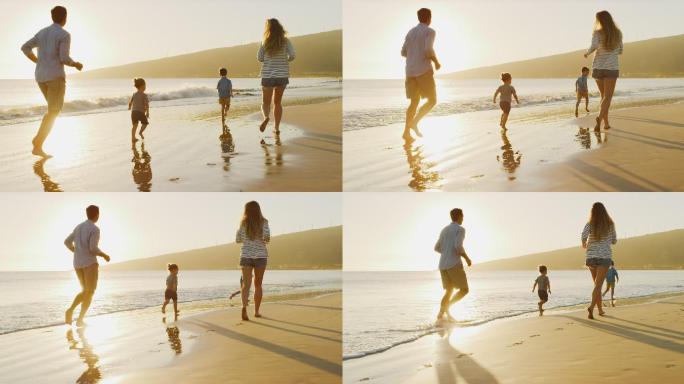 幸福的一家人在沙滩上追逐