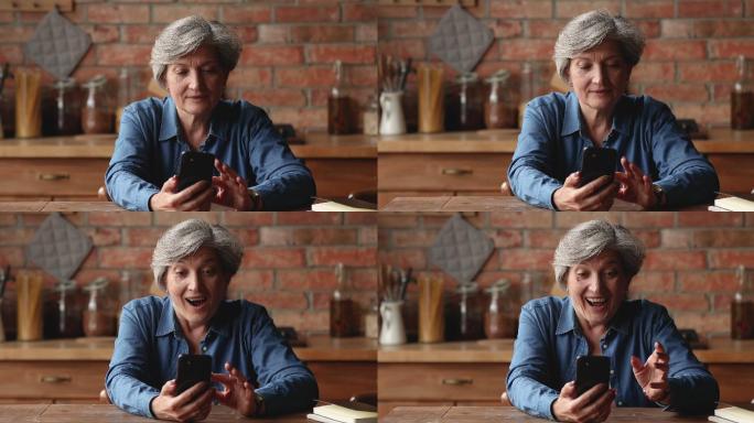 快乐的年长女性通过短信收到好消息