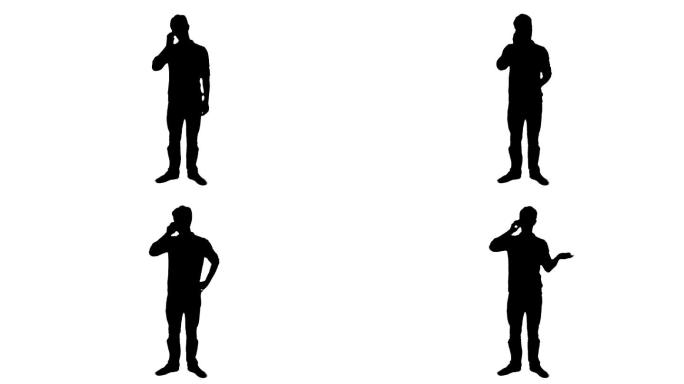 一个站着的男人独自接听电话的剪影。