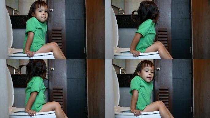 上厕所的小女孩日本卫浴坐便器卫生间