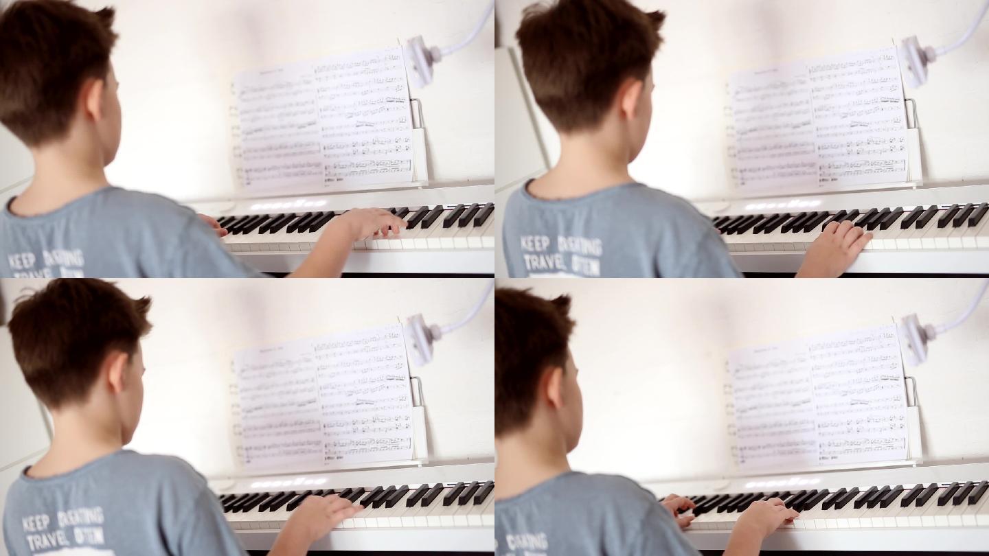 男孩弹钢琴小男孩小孩子小学生