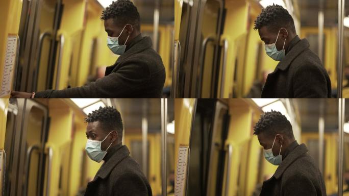 戴着口罩的地铁通勤者从地铁车厢出来