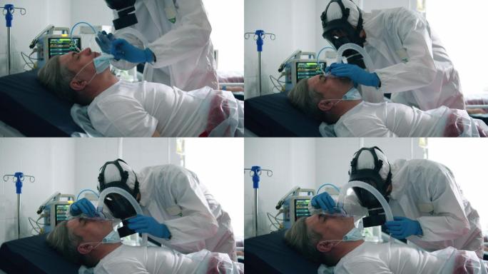 医护人员给一名患者戴氧气面罩