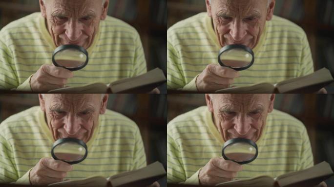 手里拿着放大镜的老人看着书页。
