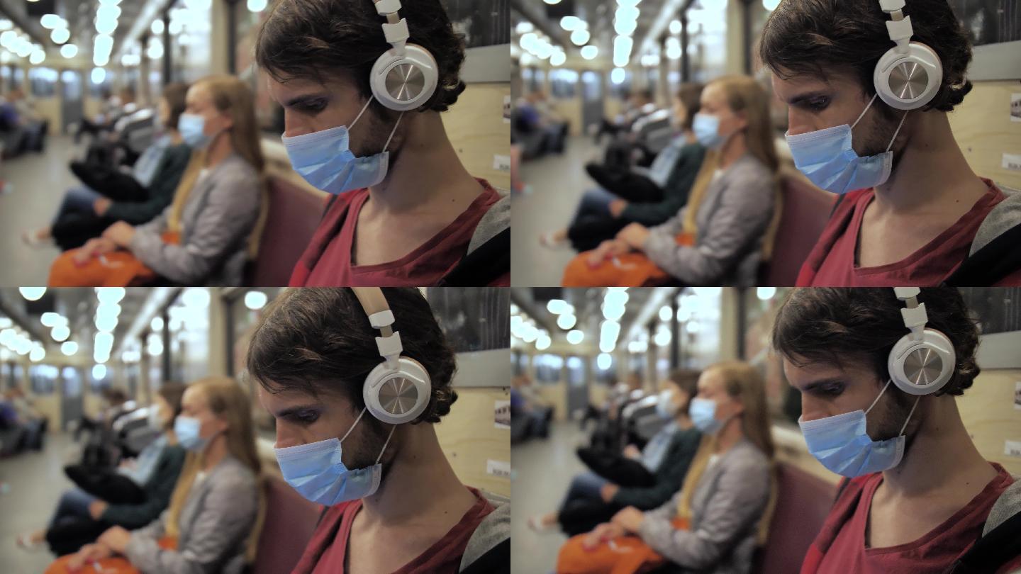 地铁列车上的戴口罩和耳机的人