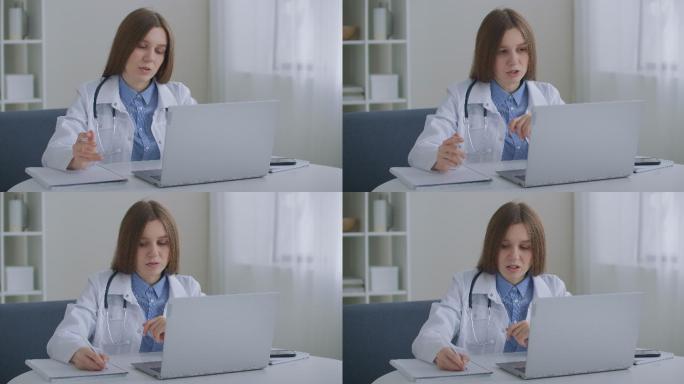在笔记本电脑上通过视频聊天与患者交谈