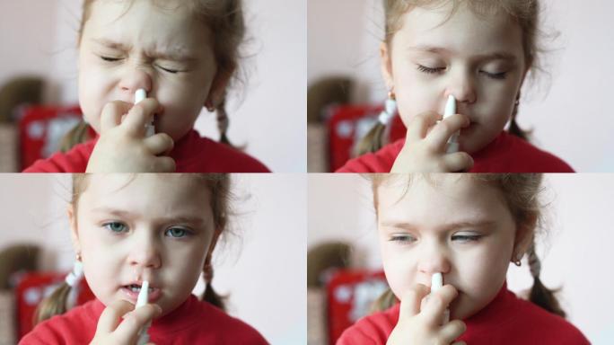 小女孩在鼻子里喷了一种喷雾，家庭治疗。