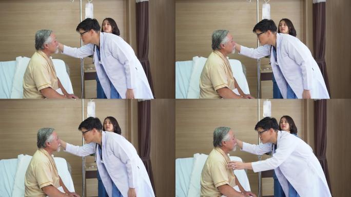 医生检查老年男性患者的眼睛