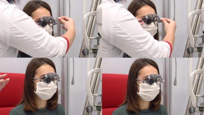 眼科医生在检查女孩的视力
