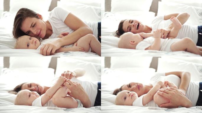一位母亲带着孩子躺在床上玩得很开心