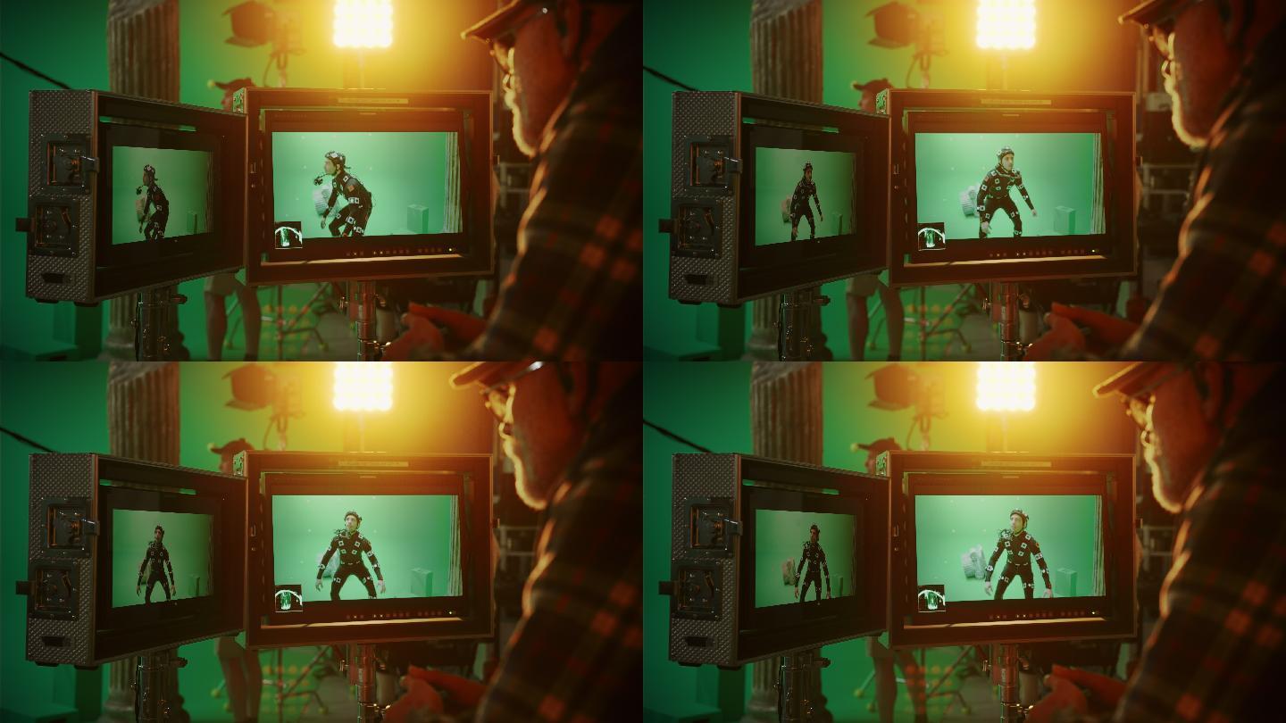 导演看着显示器，指导绿色屏幕CGI场景