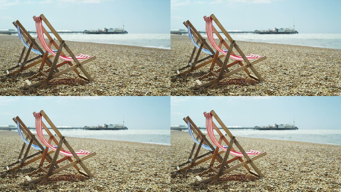 海滩上的空躺椅海边岸边日光浴空镜头