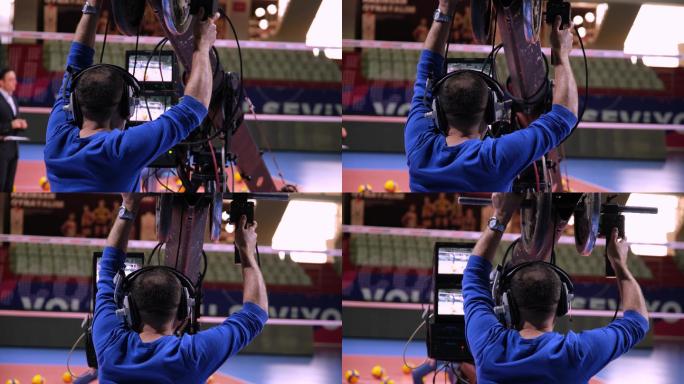 摄影师在一个电视节目中使用相机三角架