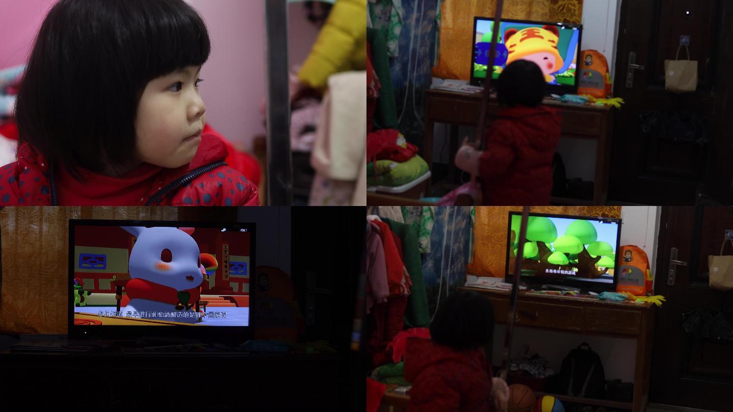 单独一个小孩专注看电视动画片